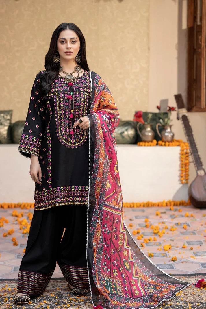 Black embroidered lawn suit with shuttle laces and tilla dori neckline, featuring a colorful lawn net dupatta and lawn trousers